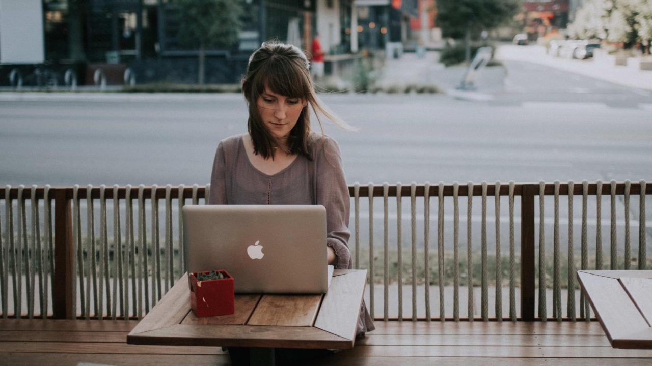 Person using a laptop computer.