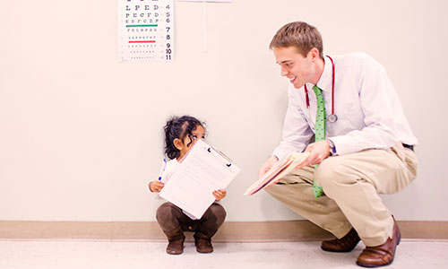 Photo of doctor and a child patient.